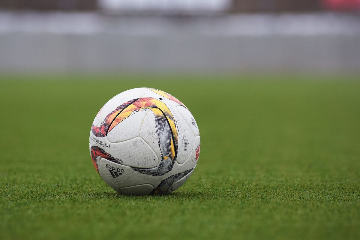 Football on the grass of the pitch