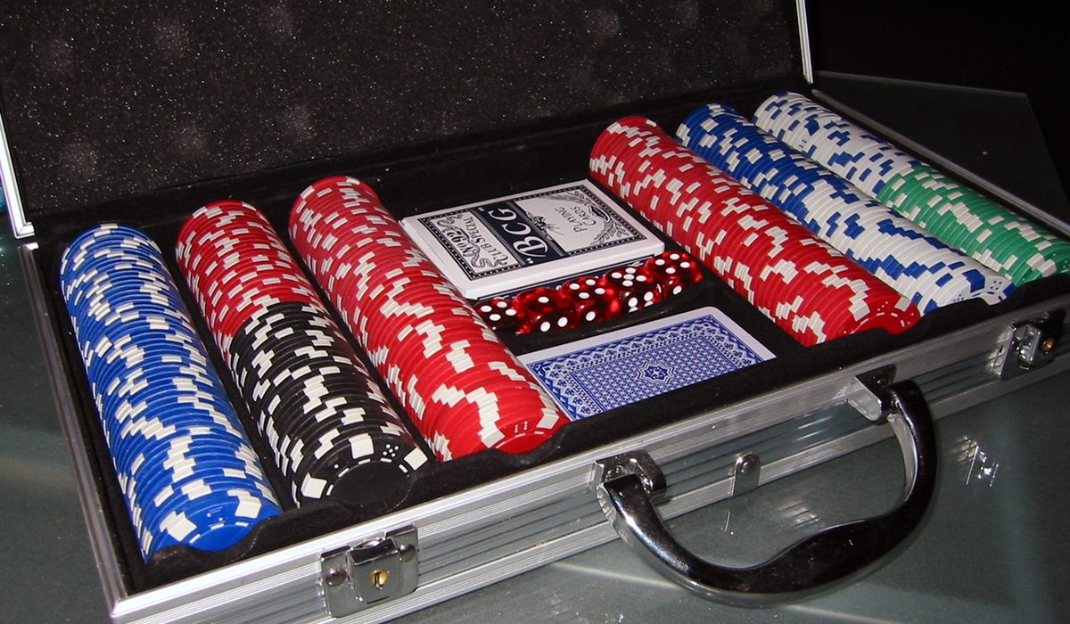 Stack of banknotes with chips on a table