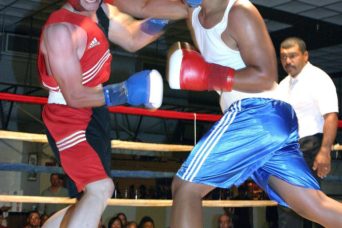 Two boxers trading punches in the ring