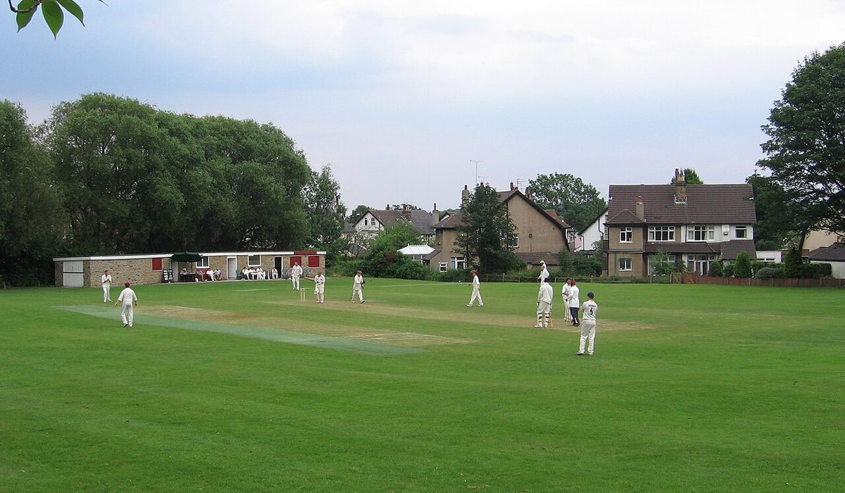 Cricket match on a grass ground