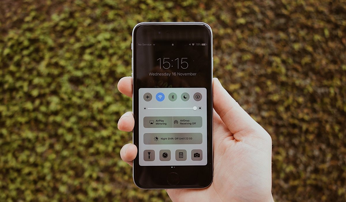 Smartphone in hand with a bonus screen