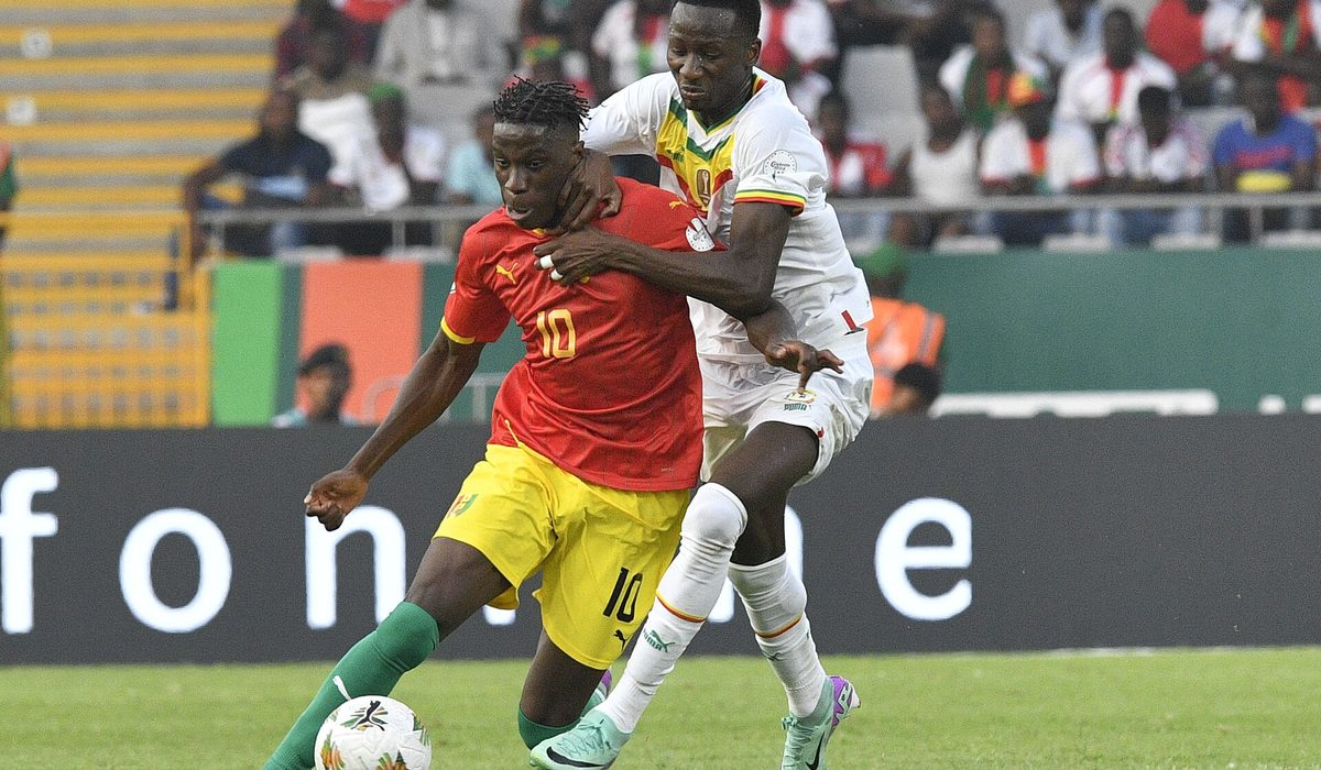 Football players in action on the pitch